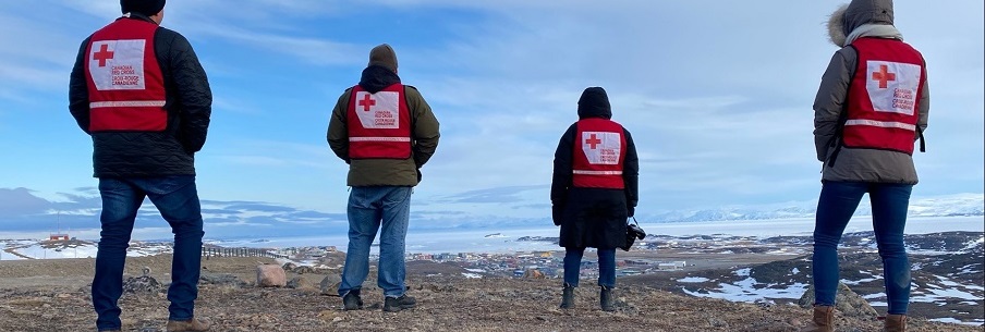 Red Cross volunteers looking into the horizon