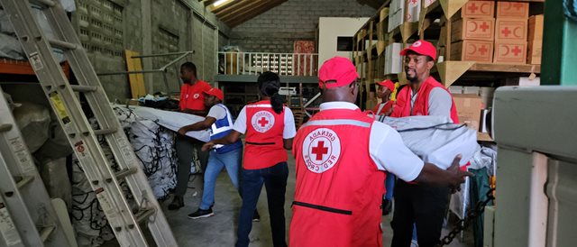 Red Cross personnel in Granada load a truck of relief items in response to Hurricane Beryl.