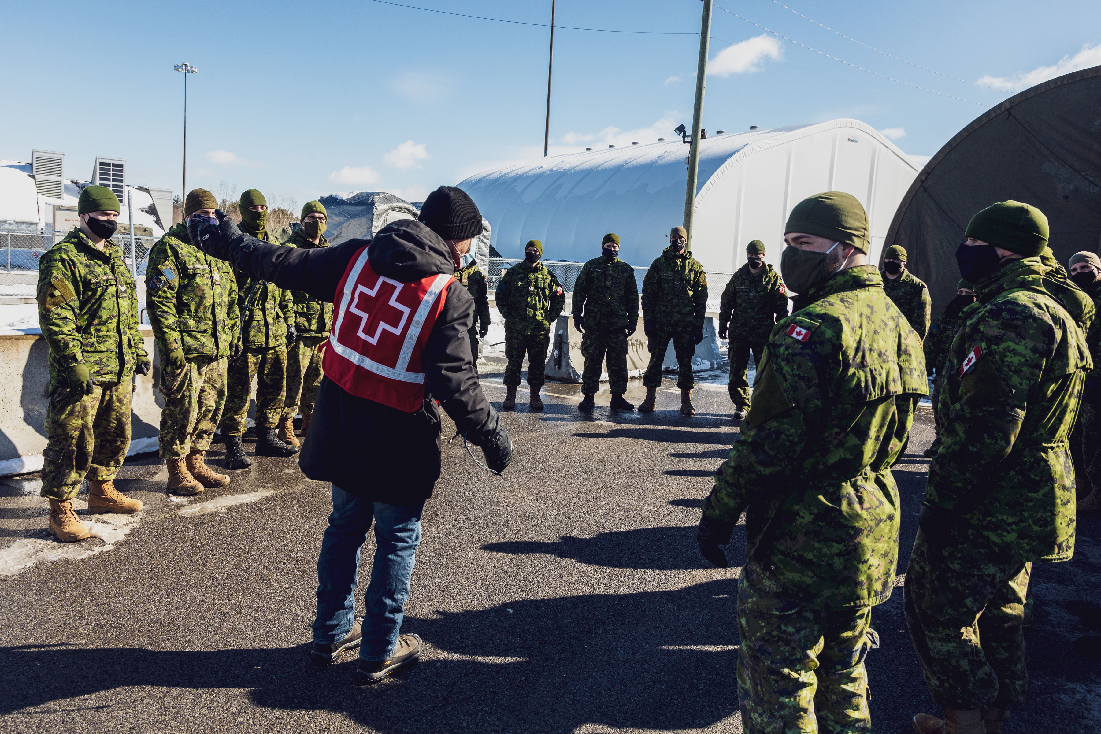 A Red Cross staff member helps to build the capacity of members of the military.