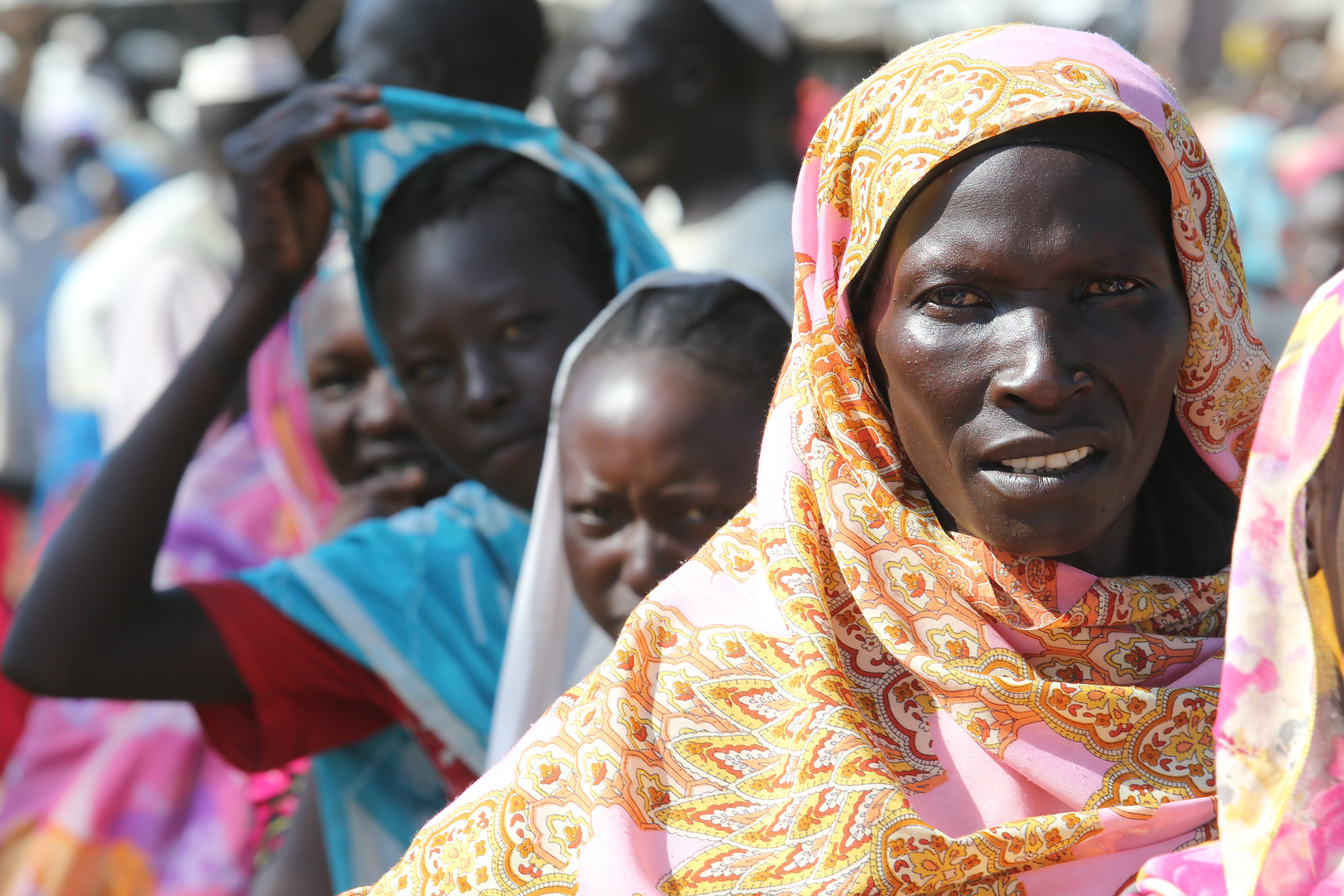 Women queue up in South Sudan to collect supplies from the ICRC.