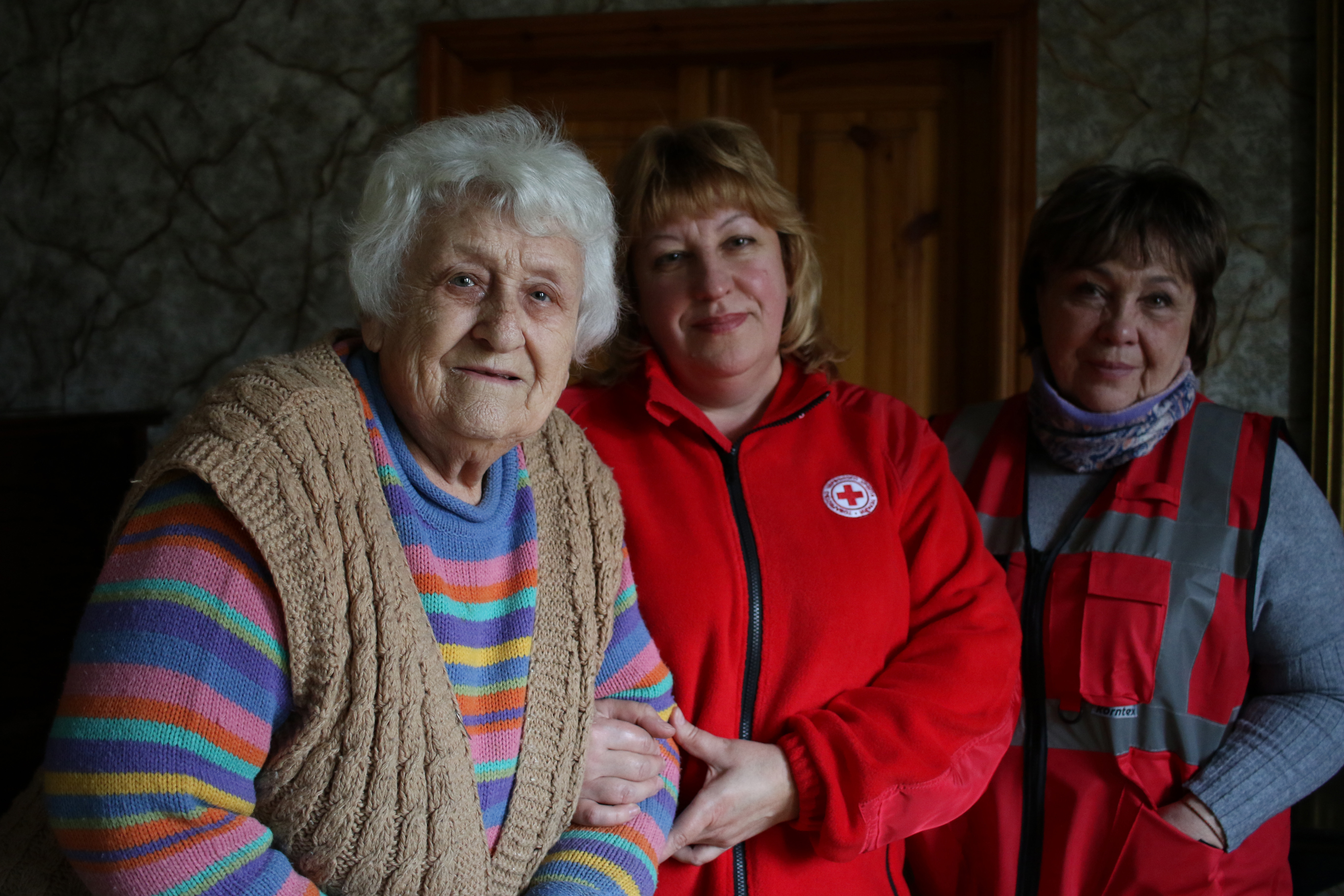 A group of three women standing together